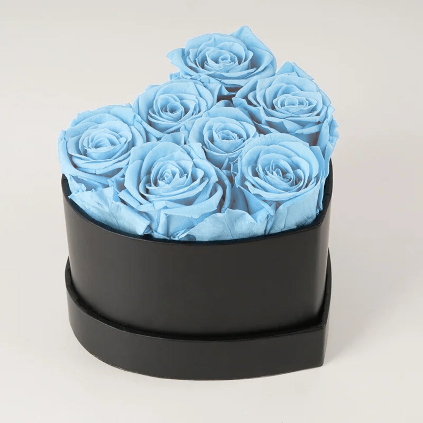Caja de rosas de corazón eterno con 7 rosas eternas