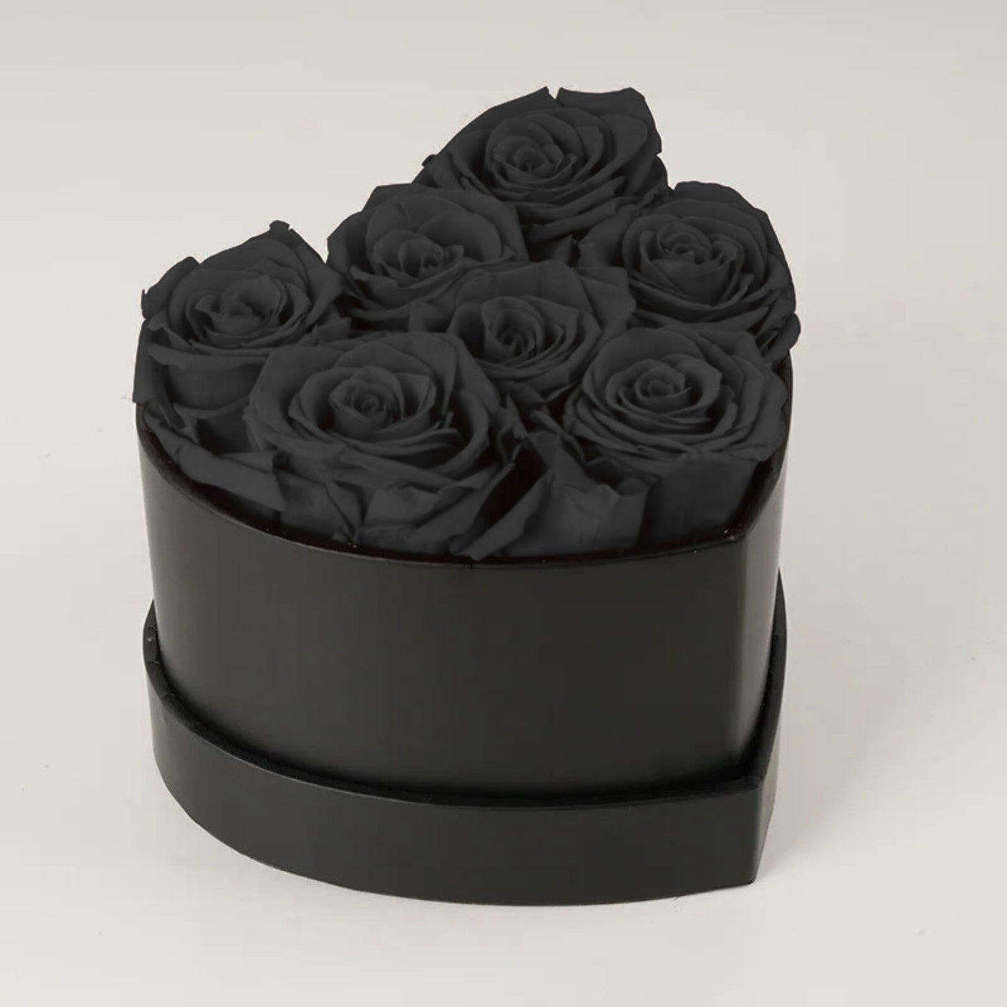 Caja de rosas de corazón eterno con 7 rosas eternas