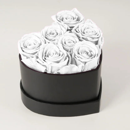 Caja de rosas de corazón eterno con 7 rosas eternas