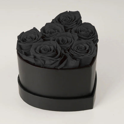 Caja de rosas de corazón eterno con 7 rosas eternas
