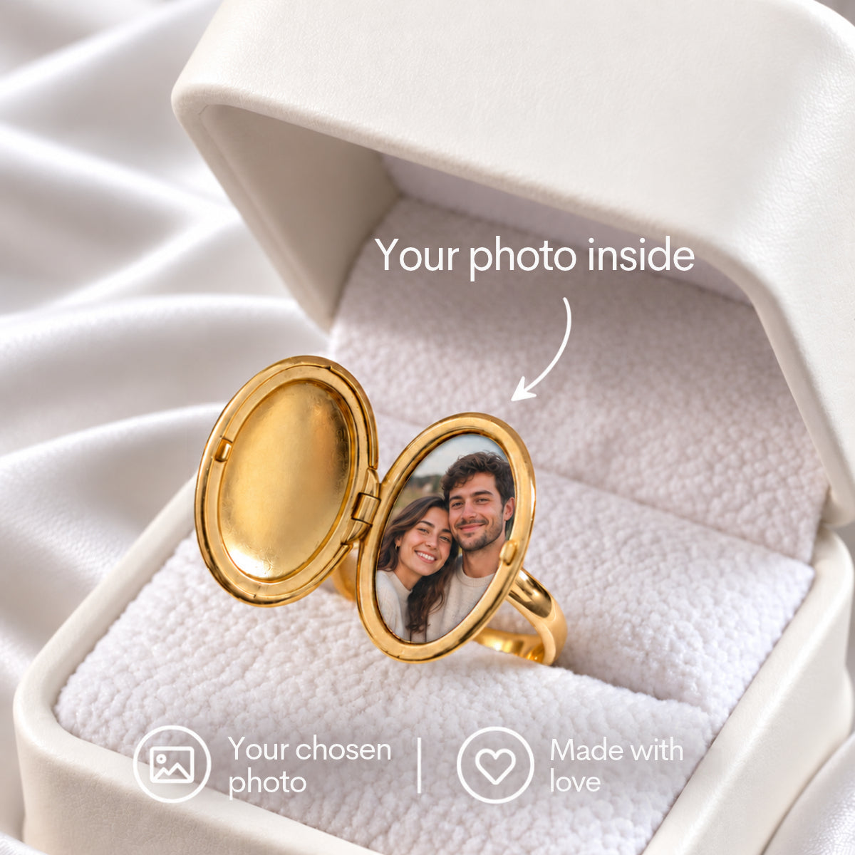 Oval Locket Ring in gold, shown open in a white ring box to reveal a couple’s photo inside the oval locket.